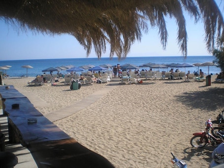 On the beach, sun loungers, beach umbrellas, beach volleyball