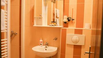 Shower, hair dryer, towels, toilet paper