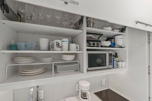 Microwave, stovetop, coffee/tea maker, blender