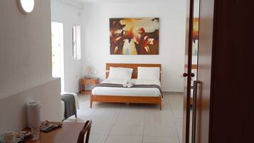 Comfort Quadruple Room, 1 Bedroom, Non Smoking, Terrace | In-room safe, individually furnished, desk, laptop workspace