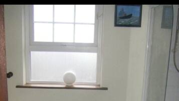 Separate bathtub and shower, deep-soaking bathtub, towels