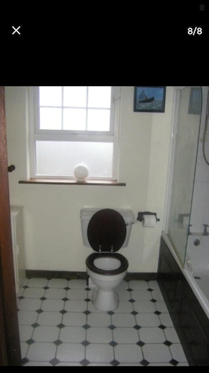 Separate bathtub and shower, deep-soaking bathtub, towels