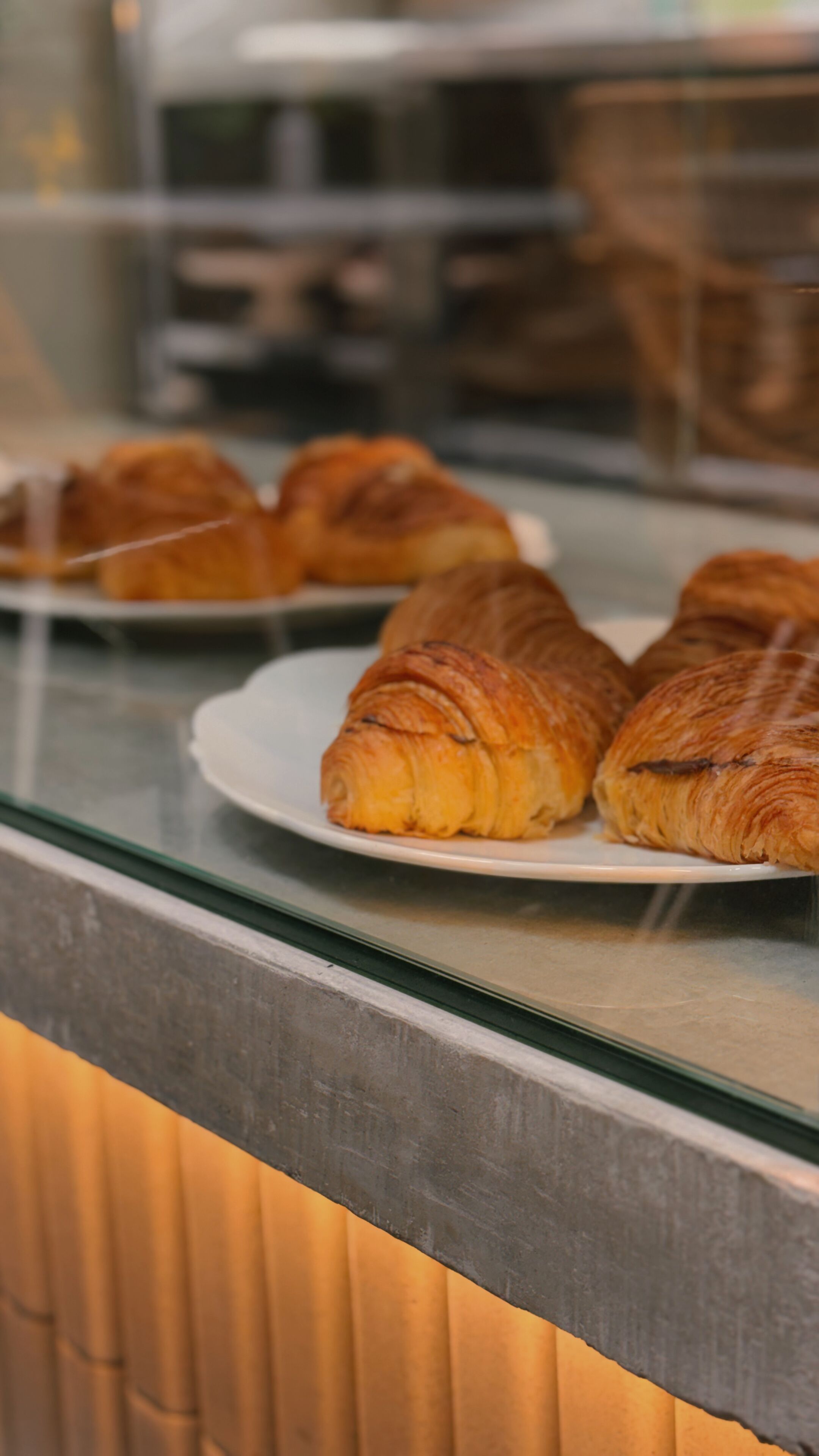 A display case with croissants.