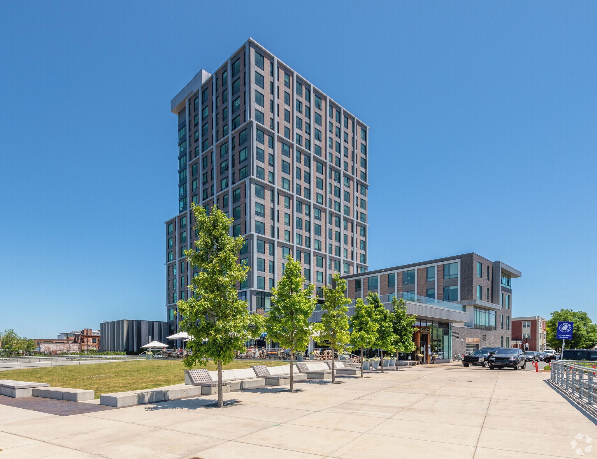 A modern building with a flat roof and a large glass facade.