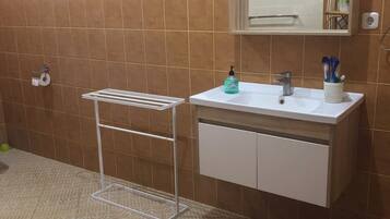 Shower, towels, soap, toilet paper