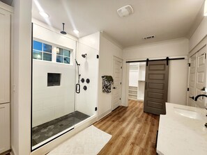 Shower, hair dryer, towels, toilet paper
