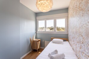 2 dormitorios, tabla de planchar con plancha, wifi gratis y ropa de cama