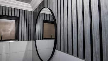 Hair dryer, towels, shampoo, toilet paper