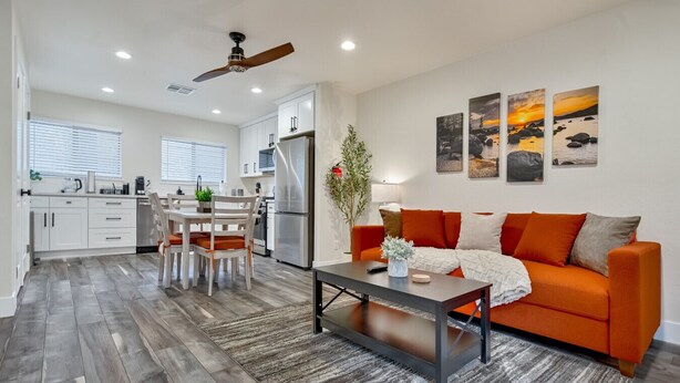 A modern living room with a sofa, coffee table, and artwork on the wall. - Walk to Kings Beach | Summer Cabin Retreat! (Kings Beach)