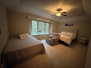 A bedroom with two beds, a ceiling fan, and a window with blinds. - 3 Bedroom house - The Woodlands - 30+ Days Only- Walk to Bear Branch from yard! (Spring)