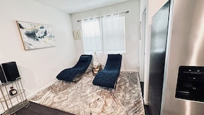 Relax in comfort with two lounge chairs and a mini-fridge at your fingertips.