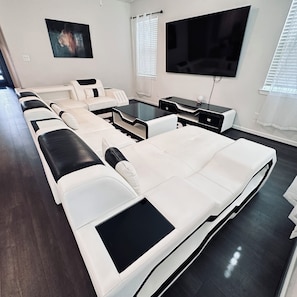Relax in this stylish living room with a comfortable sofa, flat-screen TV, and convenient coffee table.