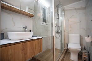 Shower, towels, soap, toilet paper