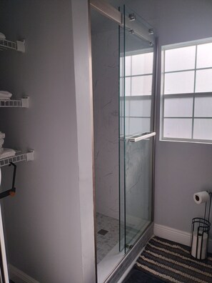 Shower, hair dryer, towels, soap