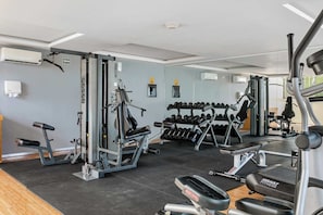 Stay active and energized in the fully equipped gym. - Oceanview Rooftop Pool & Beach Club Access (Playa del Carmen)