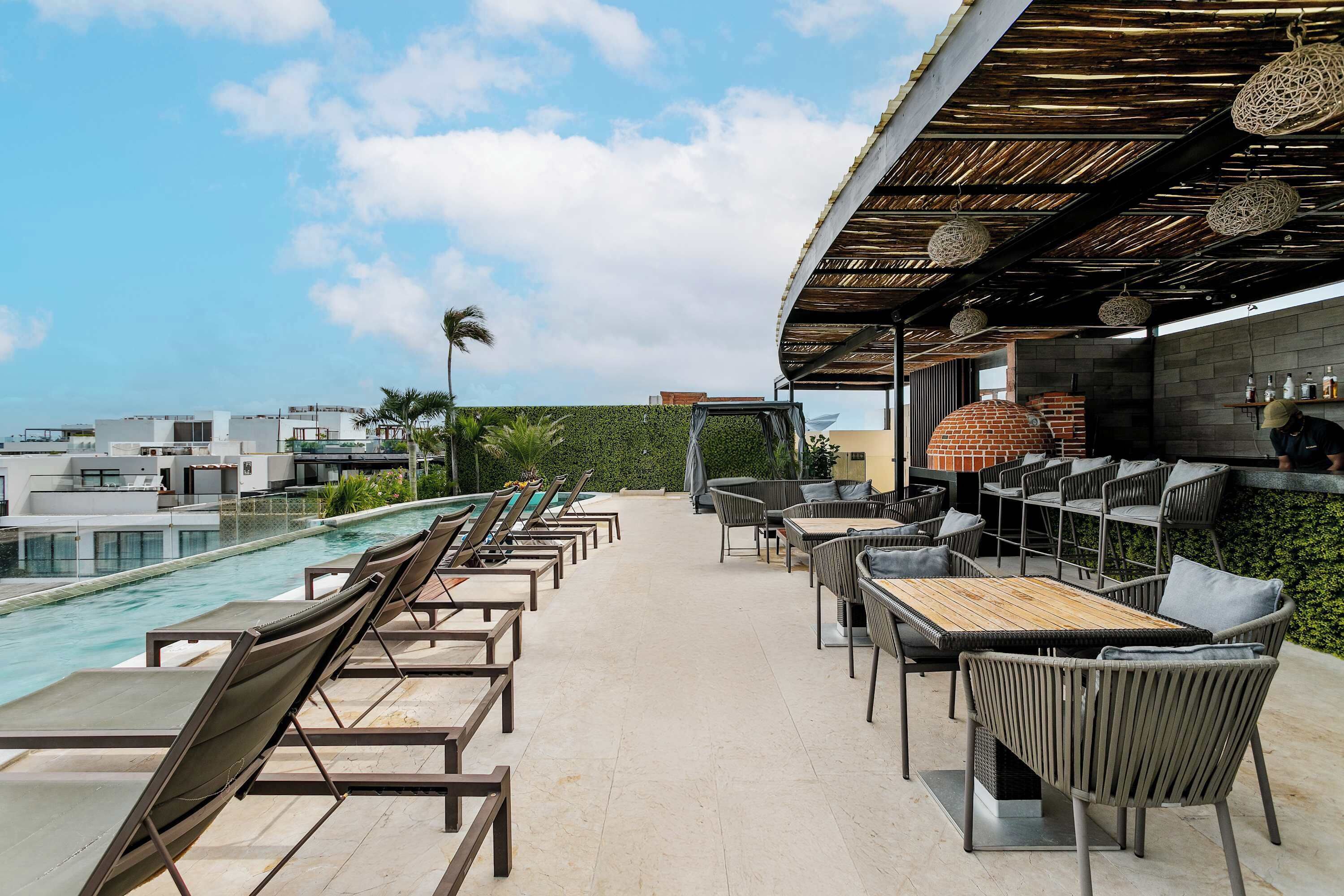 Sip your drink and soak up the sun on this lively rooftop.