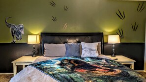 A bedroom with a bed, two bedside lamps, a headboard, and a wall with claw marks. - Close to Universal Studios, game room, Pets, Remote work (McKinney)