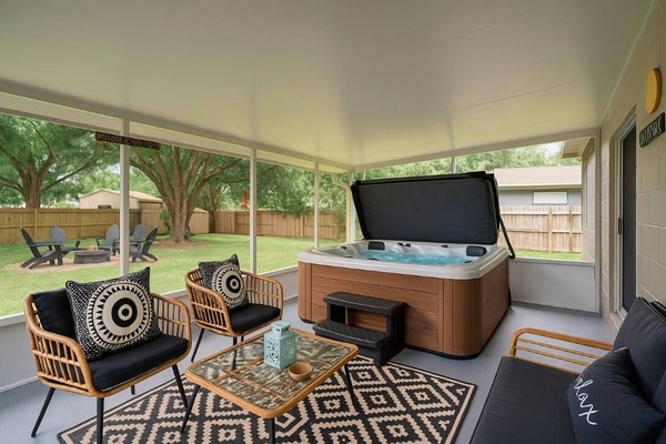 Relax in the hot tub or by the fire pit, both with cozy seating and soft lights.