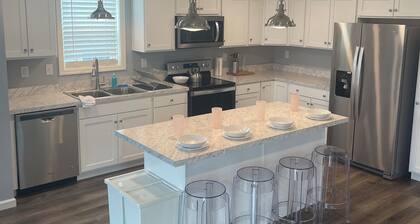 5 Bedrooms, 3 full baths, 1 outdoor shower. Walking distance to all attractions.