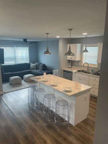 5 Bedrooms, 3 full baths, 1 outdoor shower. Walking distance to all attractions.