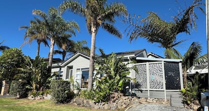 Your coastal escape. Walk to the beach. Private spa, whole house access.