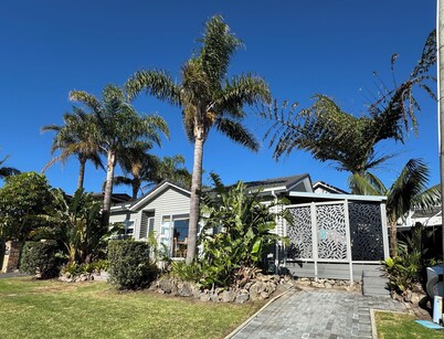 Your coastal escape. Walk to the beach. Private spa, whole house access.