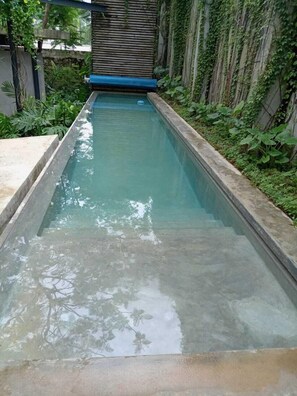 Outdoor pool, open 8:00 AM to 9:00 PM, free cabanas