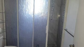 Shower, towels, soap, toilet paper