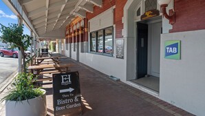 A covered outdoor area with a sign for the Europa Hotel, a bistro, and a beer garden. - Euroa Hotel (Euroa)