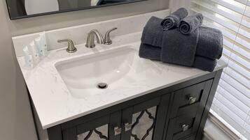 Hair dryer, towels, soap, shampoo