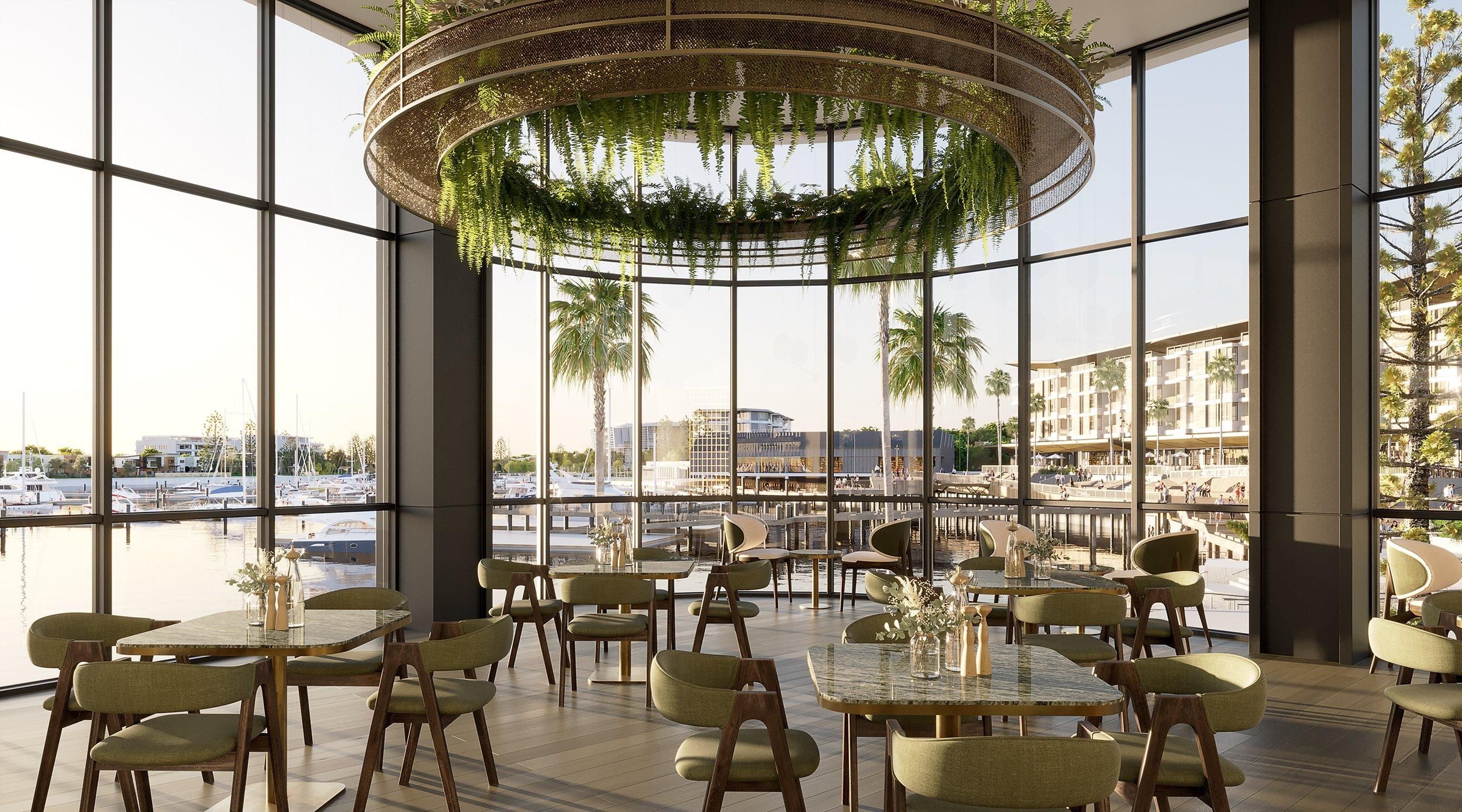 A spacious indoor dining area with large windows, modern furniture, and a hanging plant chandelier.