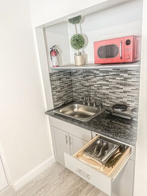 Fridge, microwave, stovetop, coffee/tea maker