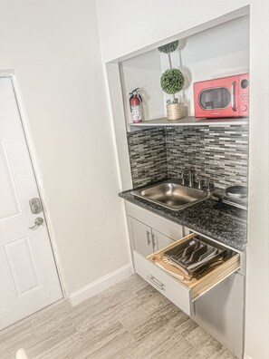 Fridge, microwave, stovetop, coffee/tea maker