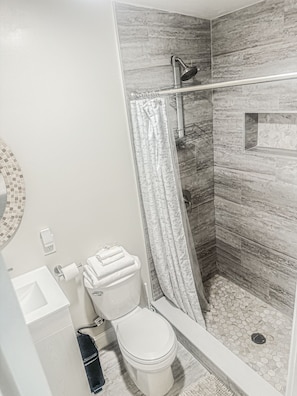 Shower, towels, soap, toilet paper