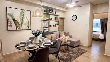 Deluxe Condo, City View | 1 bedroom, desk, laptop workspace, free WiFi
