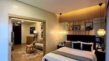 Deluxe Condo, City View | 1 bedroom, desk, laptop workspace, free WiFi