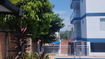 Outdoor pool, open 8:00 AM to midnight, pool umbrellas