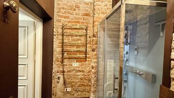 Luxury Apartment, Non Smoking, City View | Bathroom | Shower, hair dryer, towels, soap