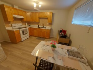 Coffee/tea maker, fridge, microwave, oven