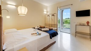 A modern bedroom with a bed, bedside table, and a view of the outdoors. - Villa Elysium for 10 With Pool Near Gallipoli (Alezio)