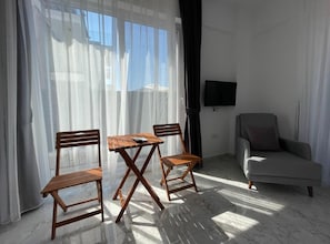Basic Apartment, Balcony, Sea View | Living area | 32-inch LED TV with cable channels - Kaş Eylül Suit Apart (Kas)