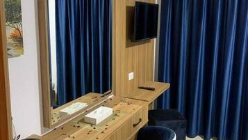 Desk, laptop workspace, blackout drapes, iron/ironing board