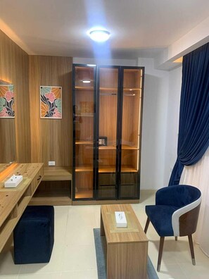 Desk, laptop workspace, blackout drapes, iron/ironing board