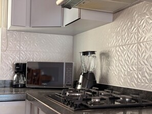 Signature Villa, Balcony, Courtyard View | Private kitchen | Fridge, microwave, dishwasher, coffee/tea maker
