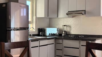 Signature Villa, Balcony, Courtyard View | Private kitchen | Fridge, microwave, dishwasher, coffee/tea maker