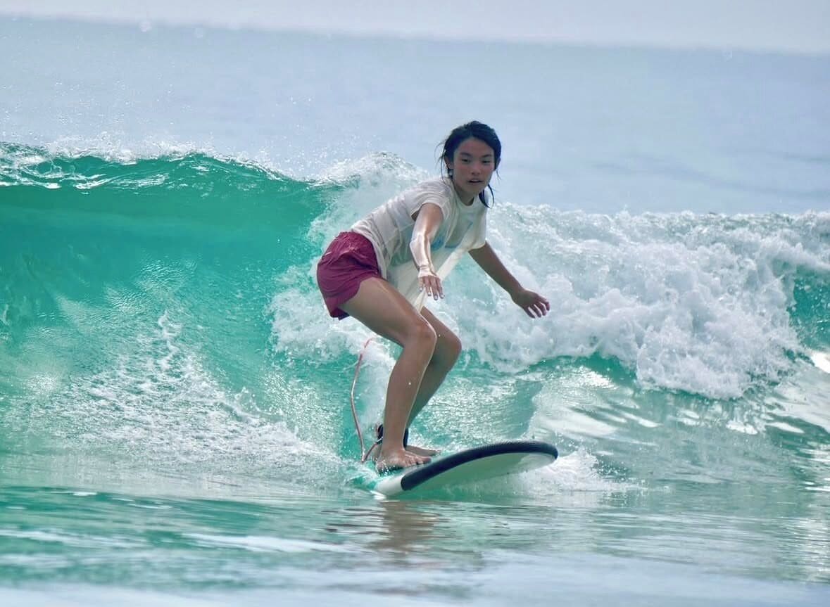A person surfing on a wave.