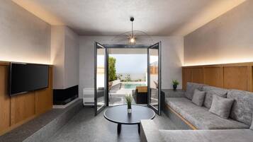 Deluxe Suite with Private Pool | Living area | TV