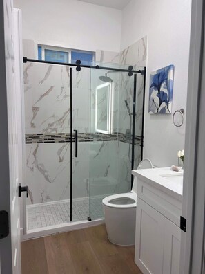 Shower, hair dryer, towels, soap