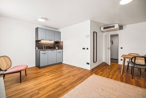 One-Bedroom Suite with Sofa Bed | Private kitchen | Espresso maker, electric kettle