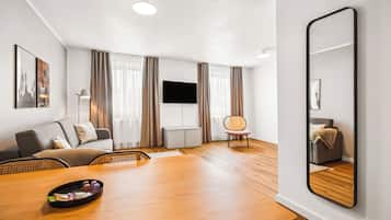 One-Bedroom Suite with Sofa Bed | Living area | 50-inch flat-screen TV with cable channels